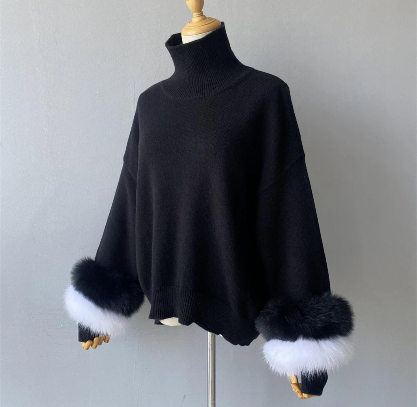 Luxury cashmere jumpers with natural fur cuffs . Jackets