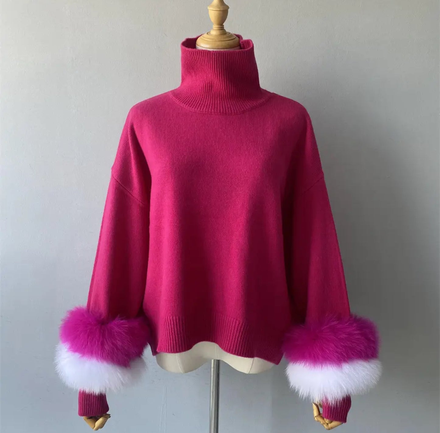 Luxury cashmere jumpers with natural fur cuffs . Jackets