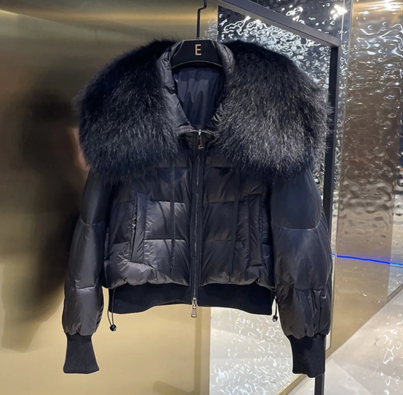 Luxury fur collar puffer coats .