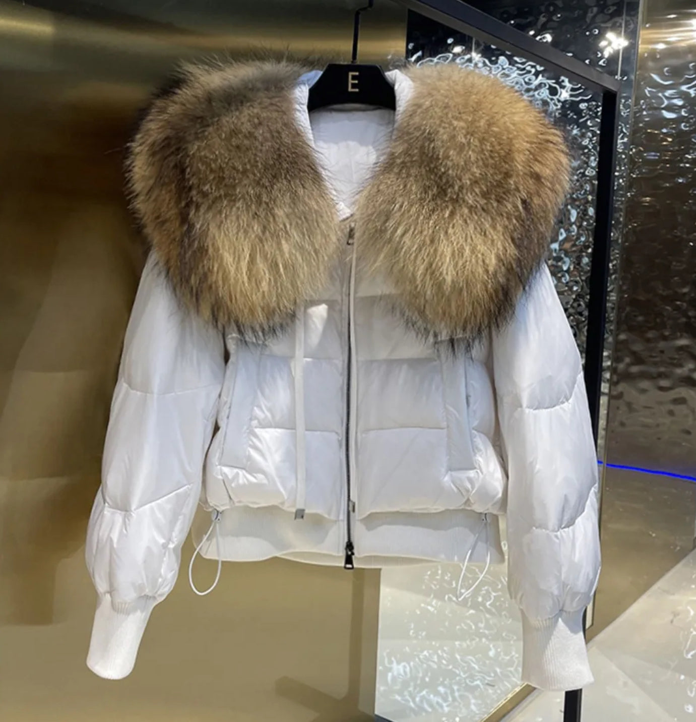 Luxury fur collar puffer coats .