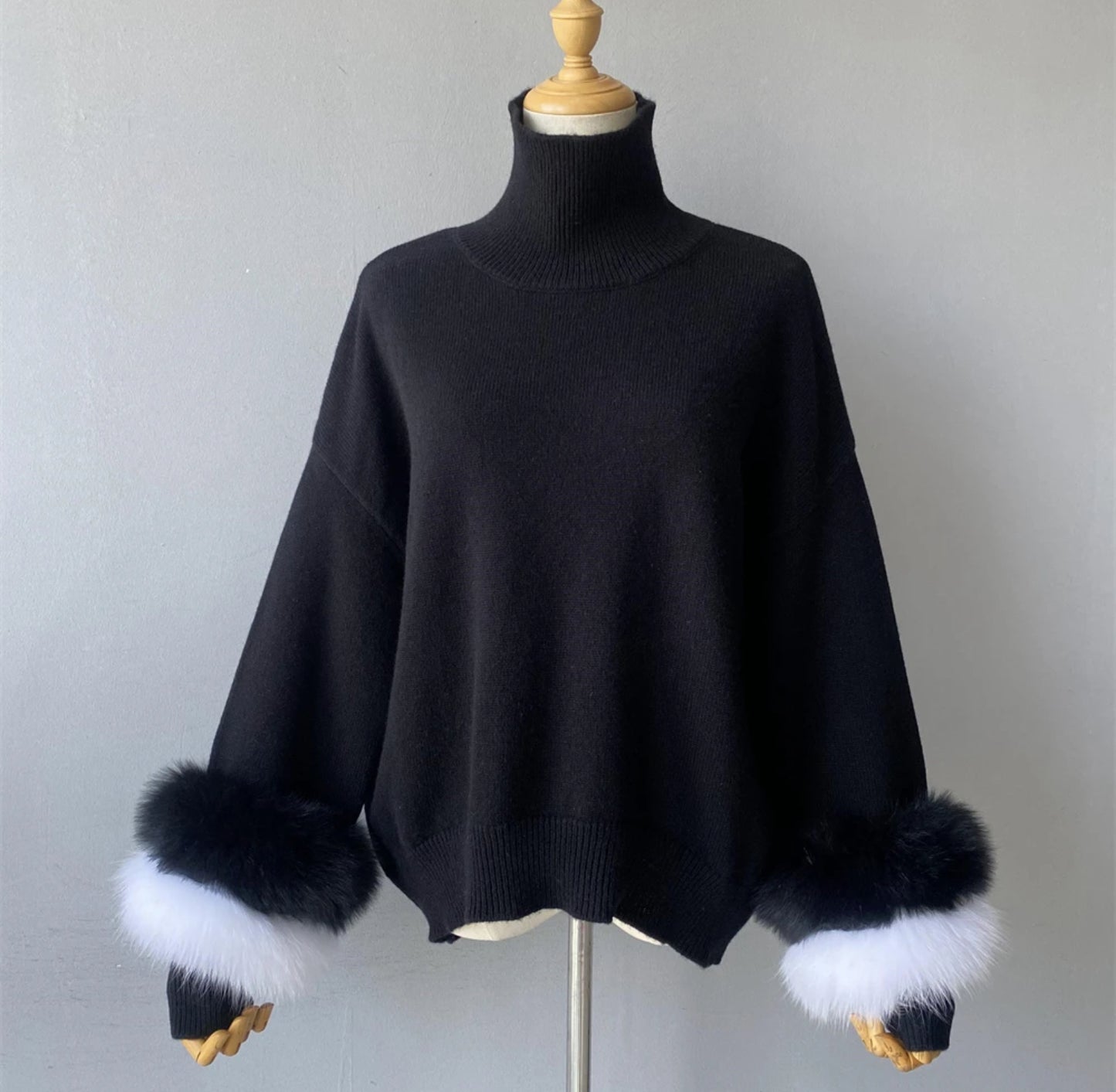 Luxury cashmere jumpers with natural fur cuffs . Jackets