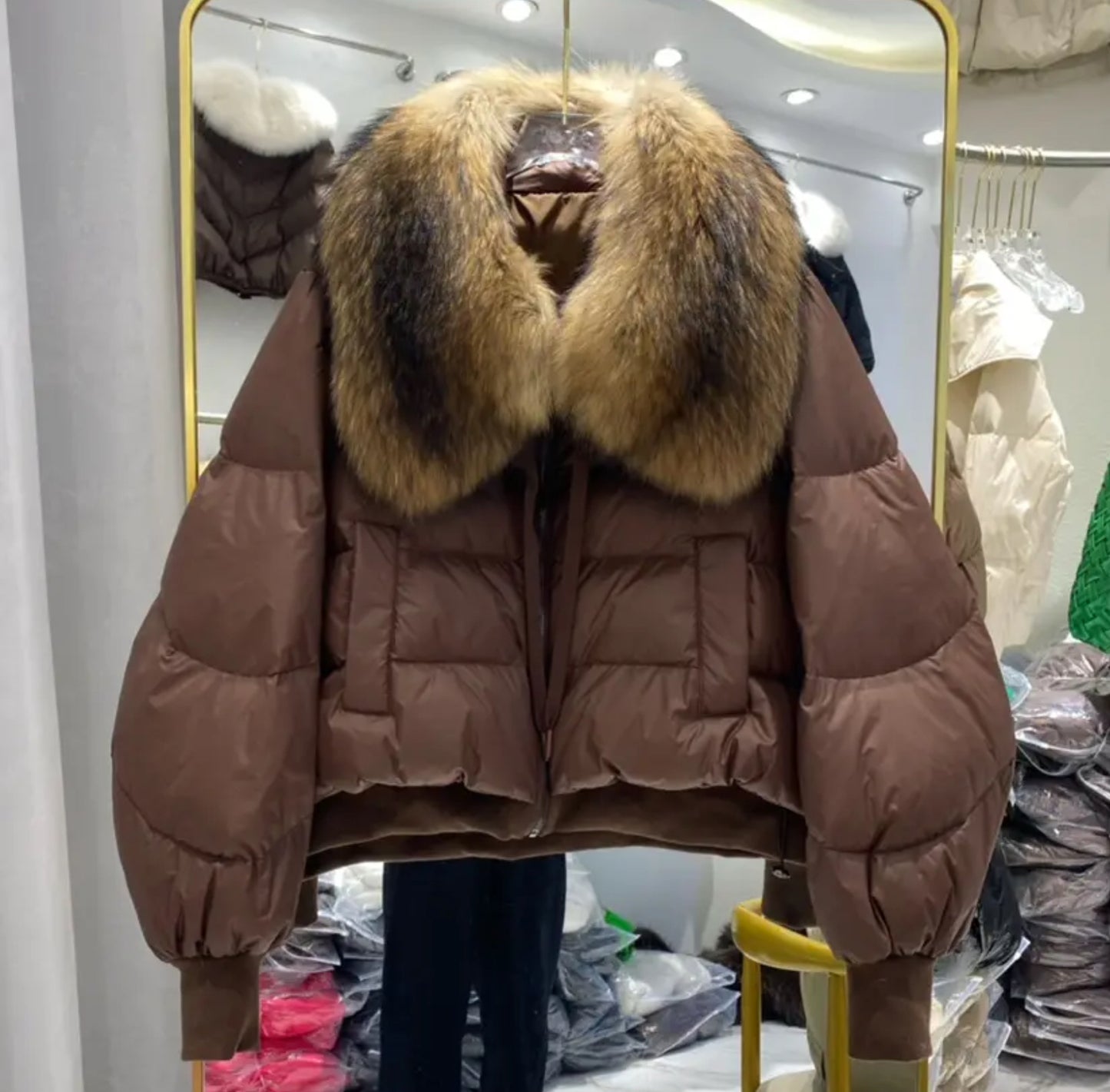 Luxury fur collar puffer coats .