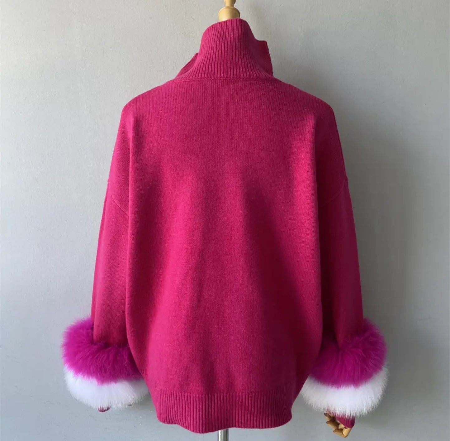 Luxury cashmere jumpers with natural fur cuffs . Jackets