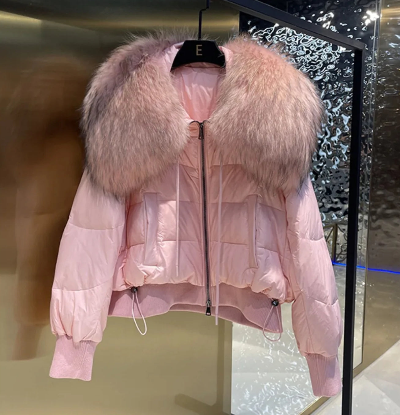 Luxury fur collar puffer coats .