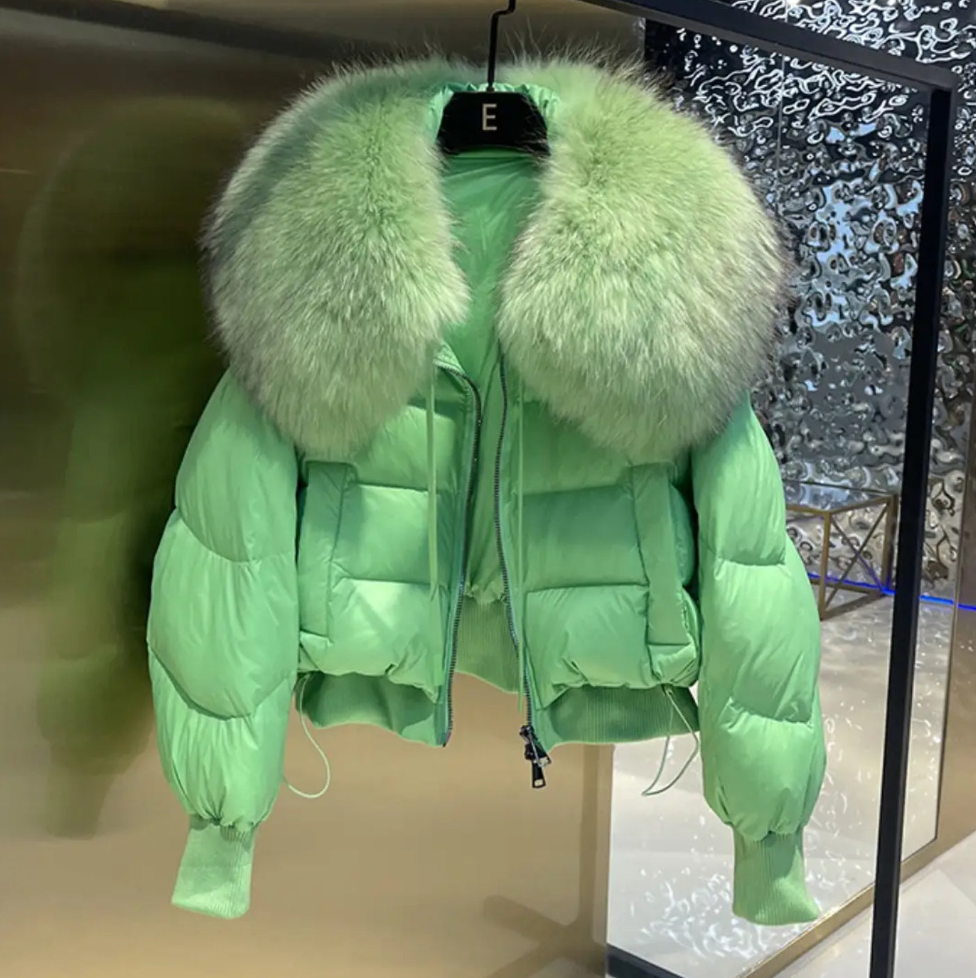 Luxury fur collar puffer coats .