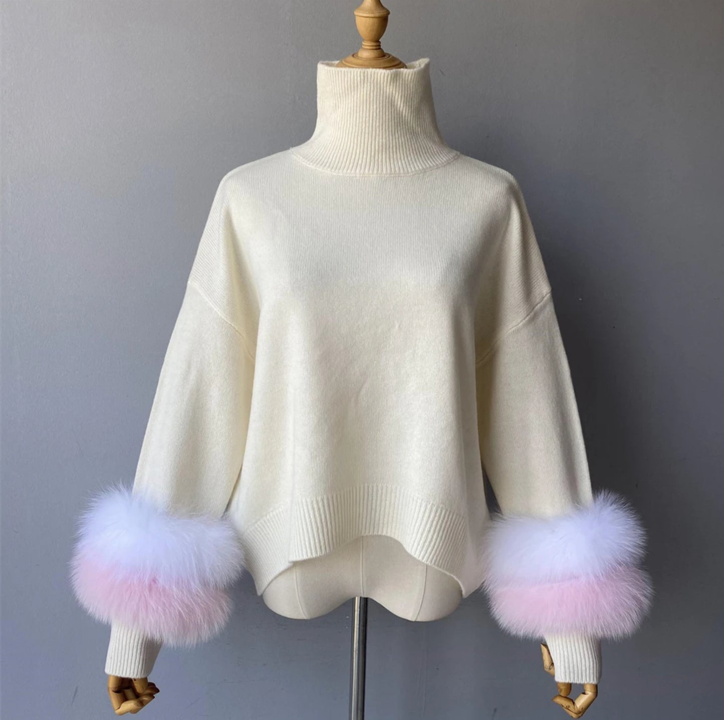 Luxury cashmere jumpers with natural fur cuffs . Jackets