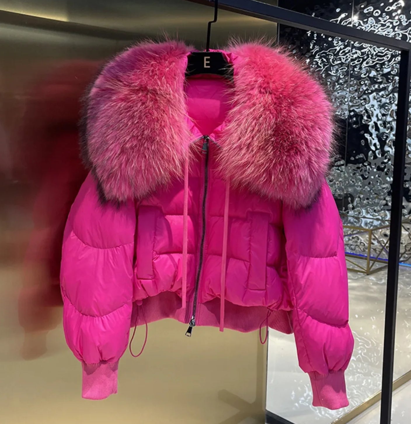 Luxury fur collar puffer coats .