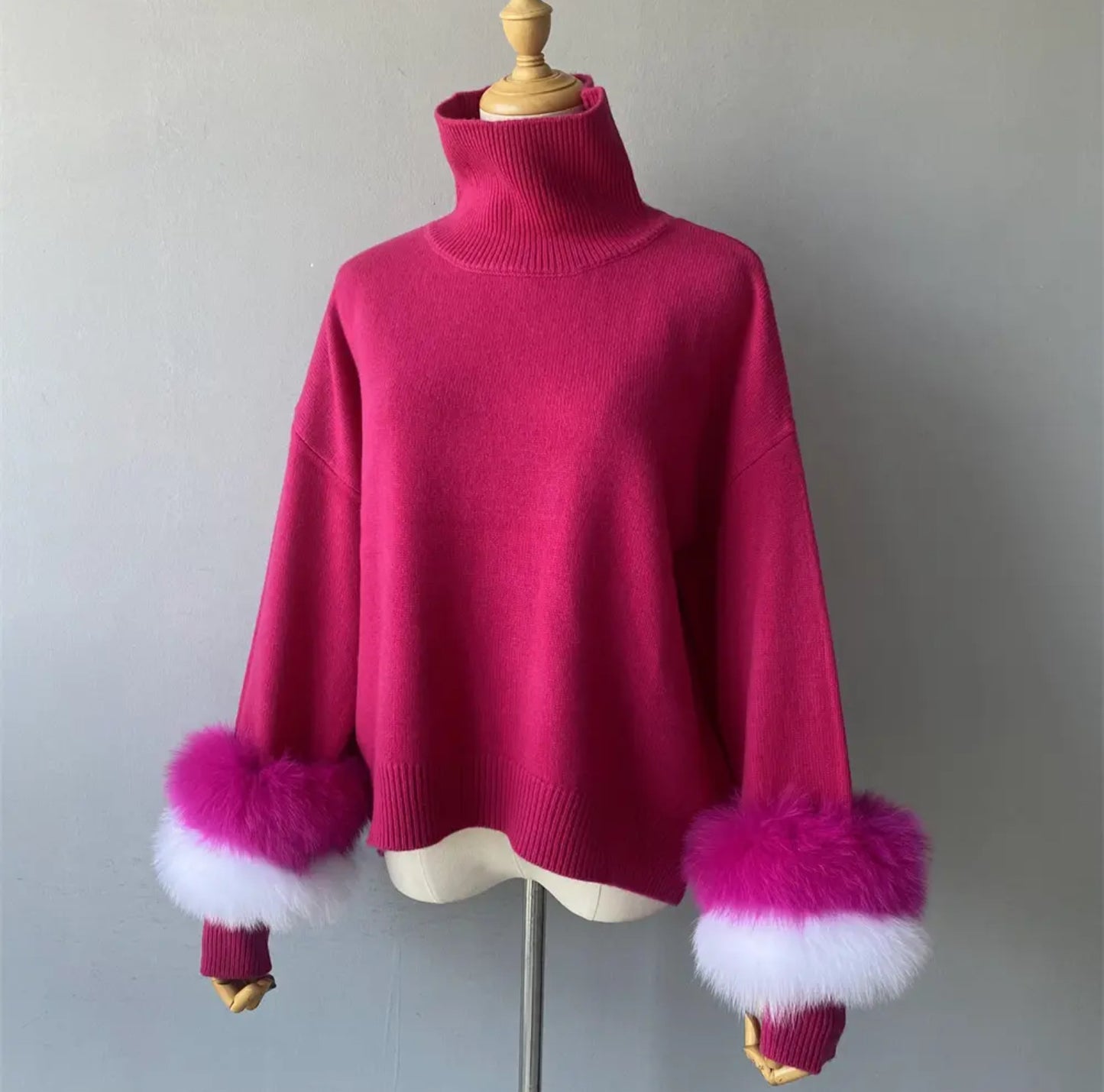 Luxury cashmere jumpers with natural fur cuffs . Jackets