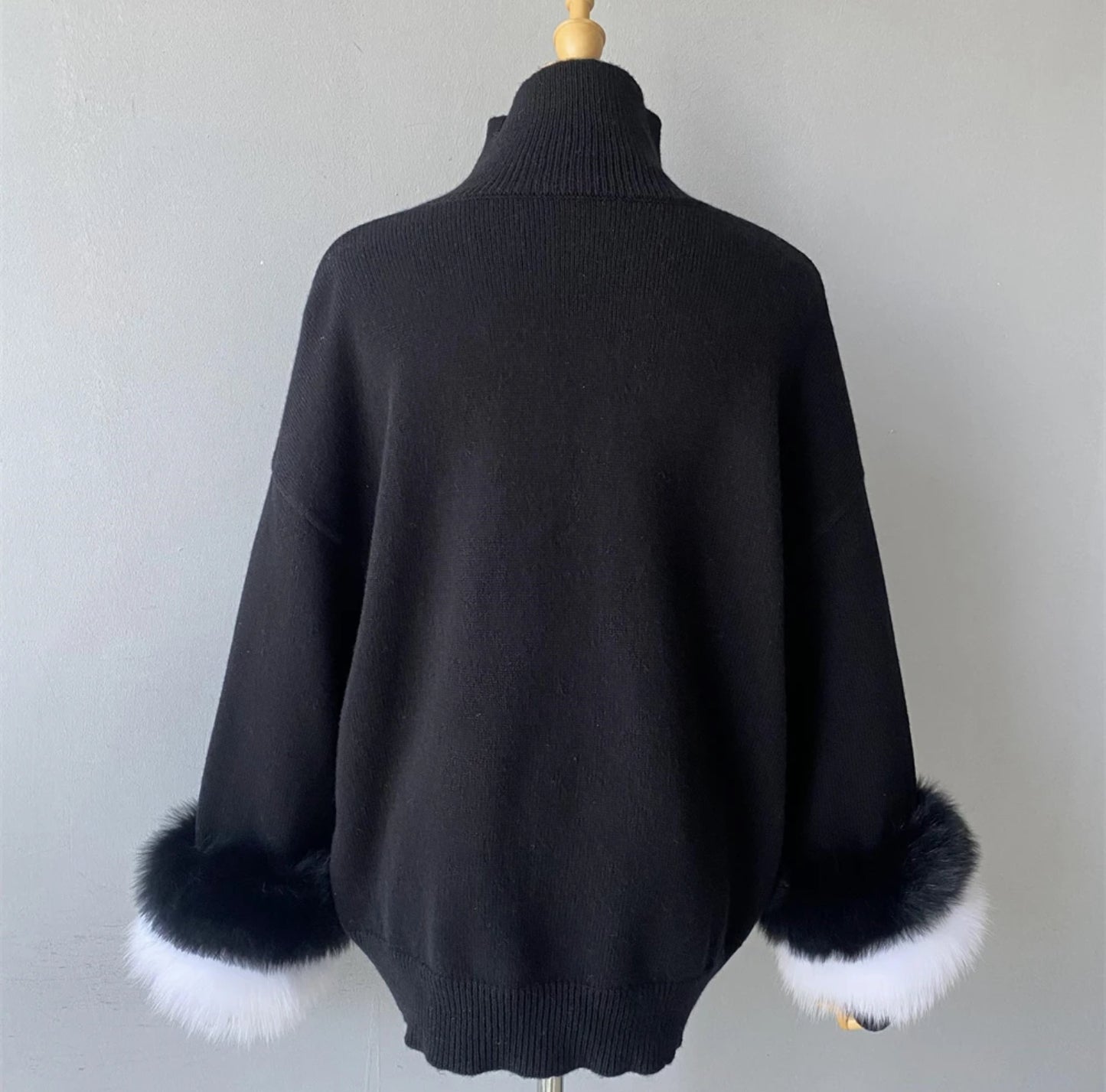 Luxury cashmere jumpers with natural fur cuffs . Jackets