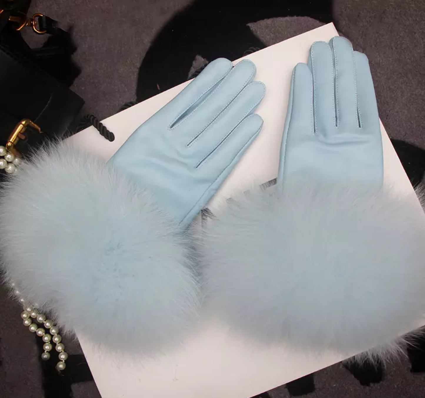 Luxury fur leather gloves .    Accessories